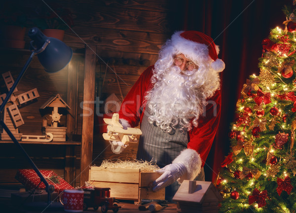 Santa Clause is preparing gifts Stock photo © choreograph