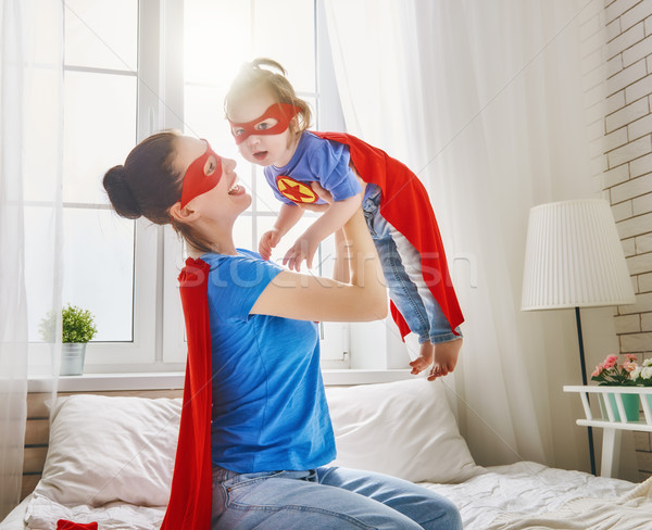 Girl and mom in Superhero costume Stock photo © choreograph