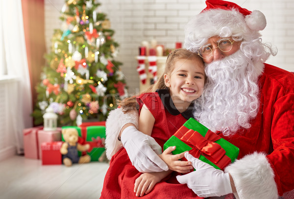 Santa Claus and little girl Stock photo © choreograph