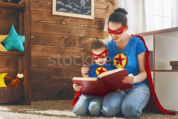 Stock photo: Girl and mom in Superhero costume