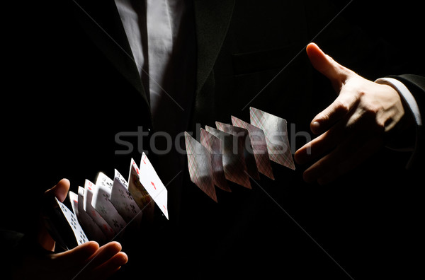 Trükk férfi mutat férfiak jókedv fekete Stock fotó © choreograph