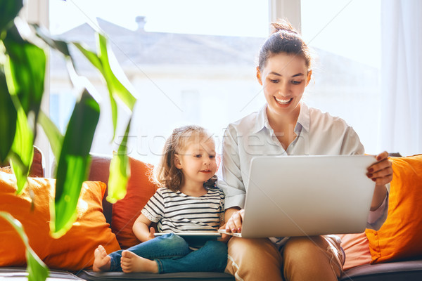 mom and child with laptop Stock photo © choreograph