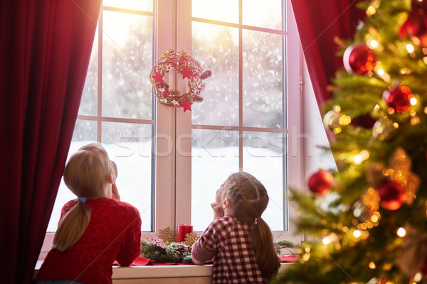 Stock photo: girls sitting by the window