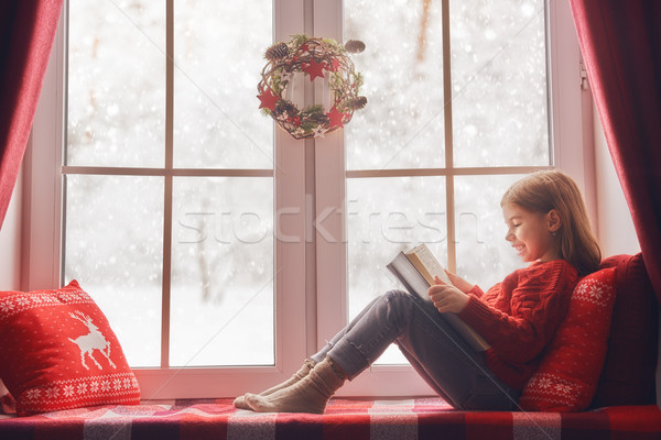 girl sitting by the window Stock photo © choreograph