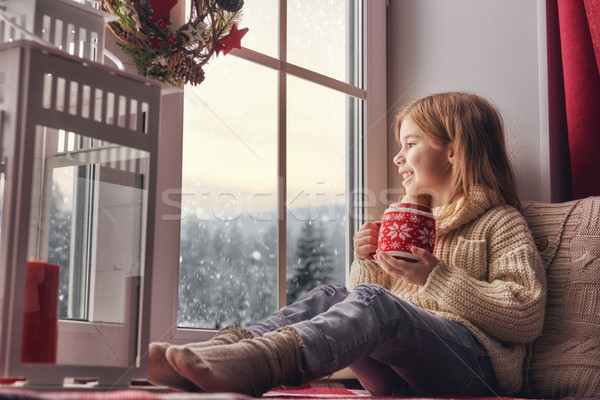 Stock photo: girl sitting by window