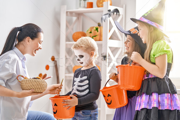 family celebrating Halloween Stock photo © choreograph
