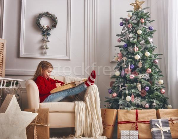 girl writes the letter to Santa Stock photo © choreograph