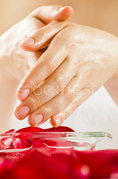 Spa kobieta ręce kwiaty strony Zdjęcia stock © choreograph