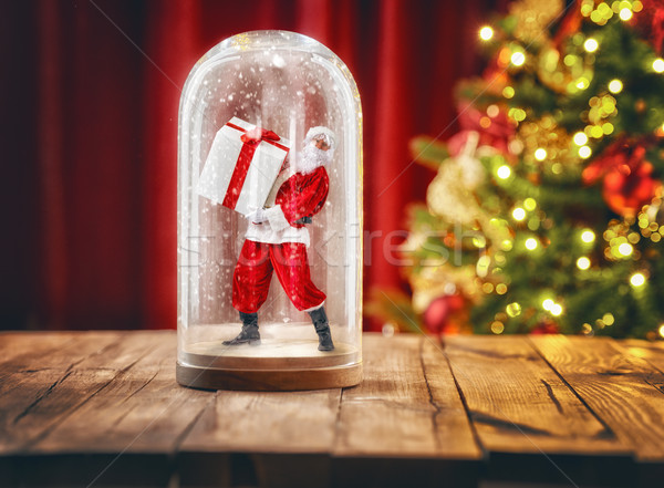 Santa inside a Christmas snow globe. Stock photo © choreograph