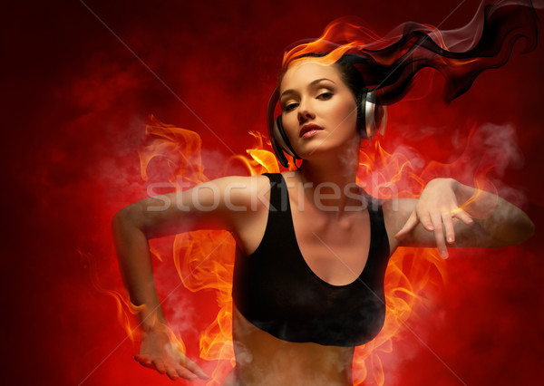 Menina fones de ouvido clube mulher fogo moda Foto stock © choreograph