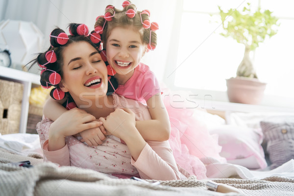 Mom and child doing hair Stock photo © choreograph