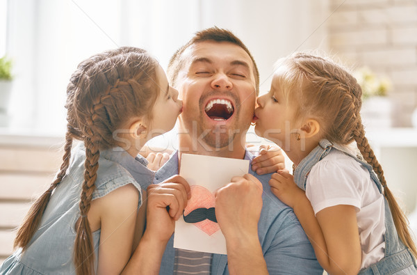 daughters congratulating dad Stock photo © choreograph