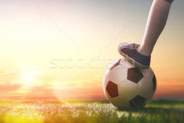 Child plays football. Stock photo © choreograph