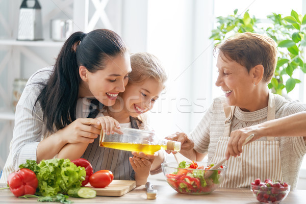 Stock photo: Happy family in the kitchen