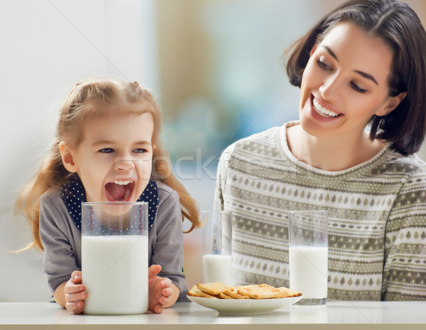 Egészséges étel lány iszik tej konyha család Stock fotó © choreograph