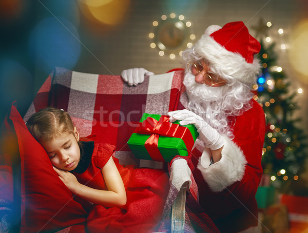 Santa Claus and little girl Stock photo © choreograph