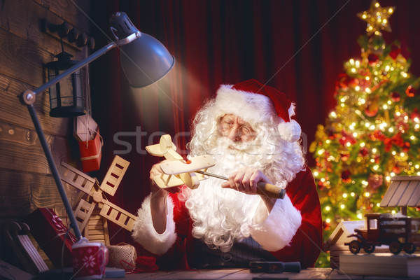 Santa Claus is preparing gifts Stock photo © choreograph