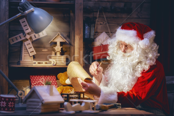 Santa Claus is preparing gifts Stock photo © choreograph