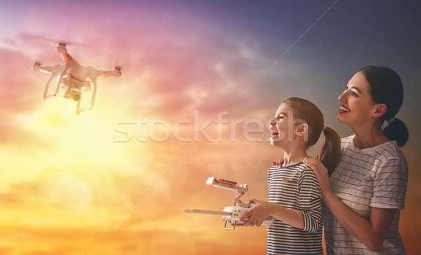 Kid and mom playing with drone Stock photo © choreograph