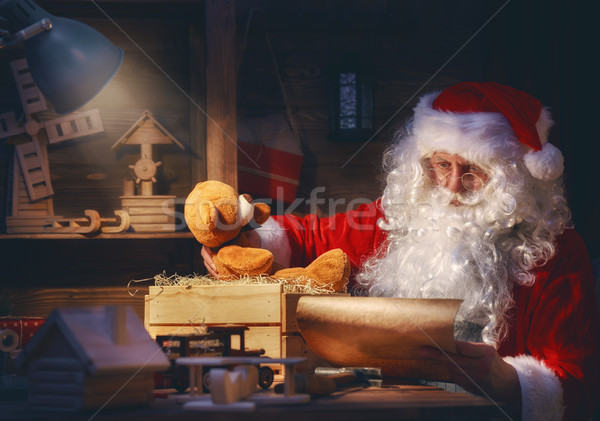 Santa Clause is preparing gifts Stock photo © choreograph