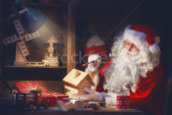 Santa Clause is preparing gifts Stock photo © choreograph