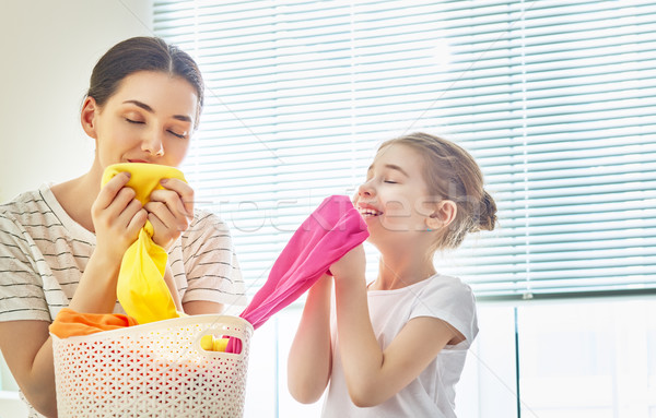 Stock photo: family doing laundry at home