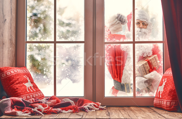 Santa Claus is knocking at window Stock photo © choreograph