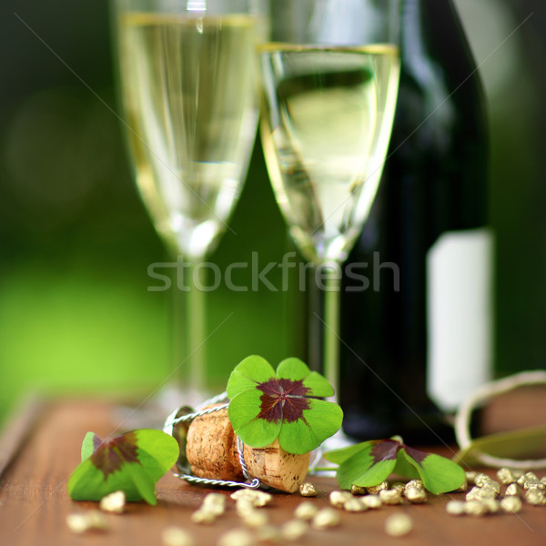Stock photo: Lucky clover and sparkling wine