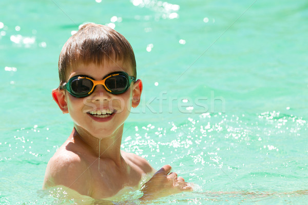 Child swimming in the pool Stock photo © chrisroll