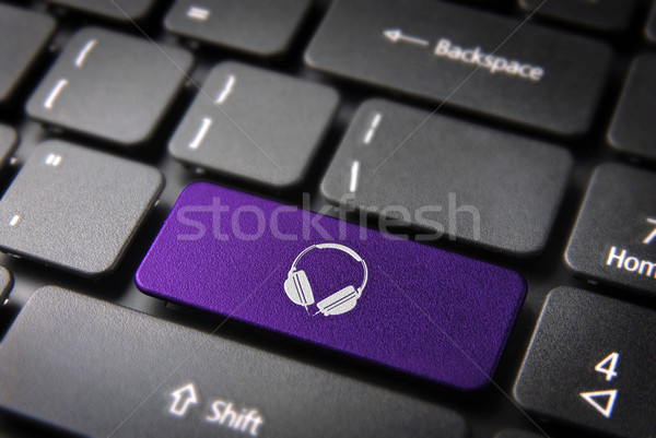 Purple Headphones keyboard key, Entertainment background Stock photo © cienpies