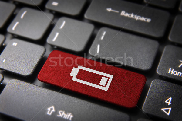 Red keyboard key low battery, energy background Stock photo © cienpies