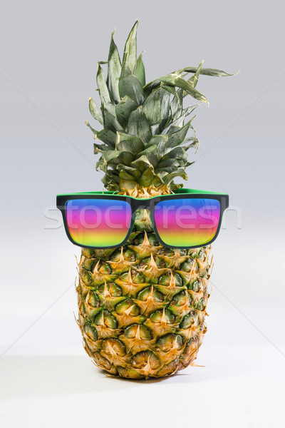 Summer pineapple fruit with colorful sunglasses  Stock photo © cienpies