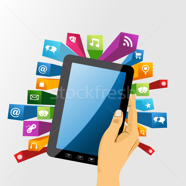 Human hand holds tablet pc with app icons. Stock photo © cienpies