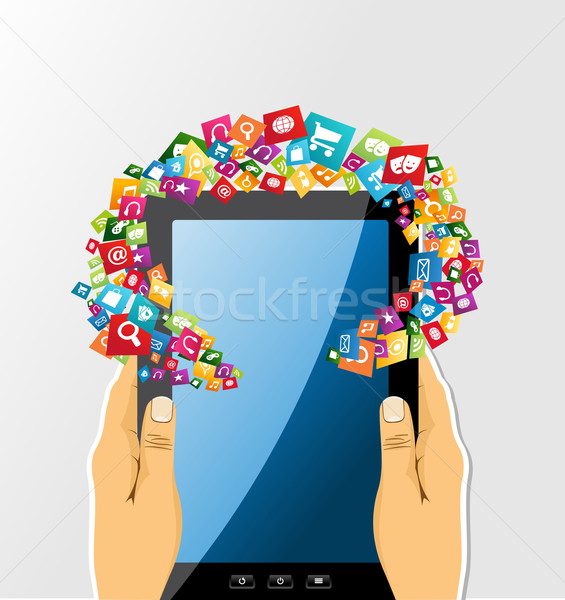 Human hands holds tablet pc app icons. Stock photo © cienpies