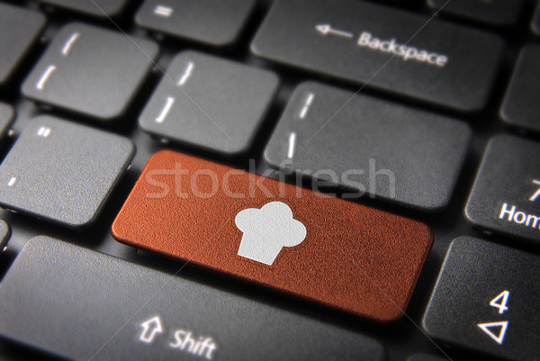 Orange Chef hat keyboard key, Food background Stock photo © cienpies