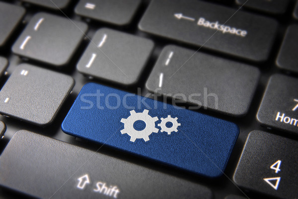 Blue Gear wheel keyboard key, Business background Stock photo © cienpies