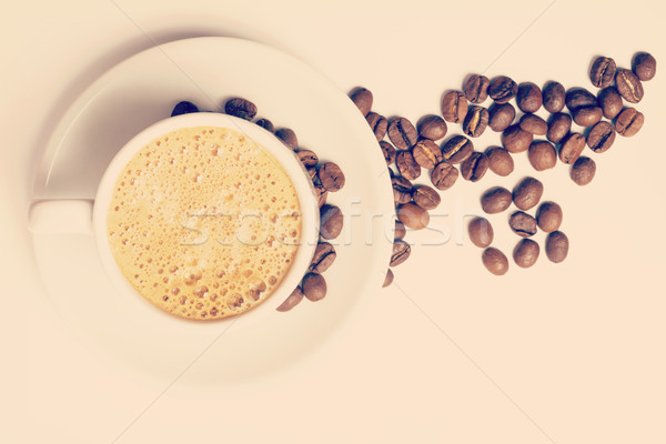 Vintage cup of coffee and roasted beans Stock photo © cienpies