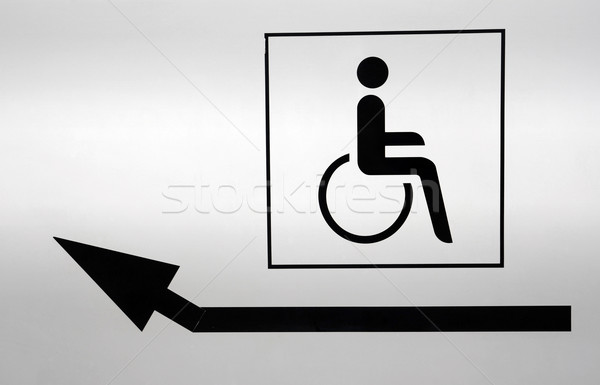 Disabili icona punta arrow bianco muro Foto d'archivio © cienpies