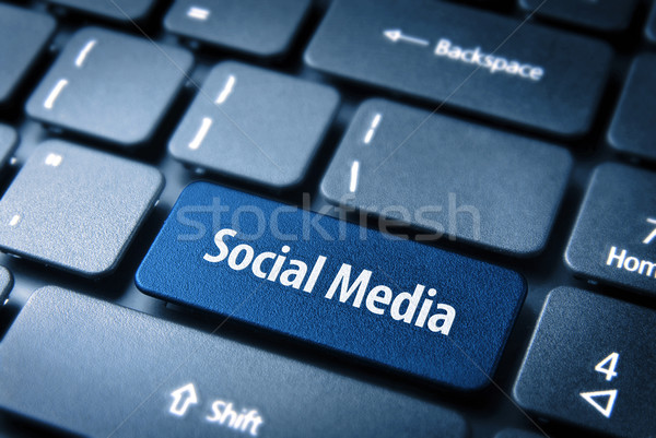 Blue Social Media keyboard key, Social background Stock photo © cienpies