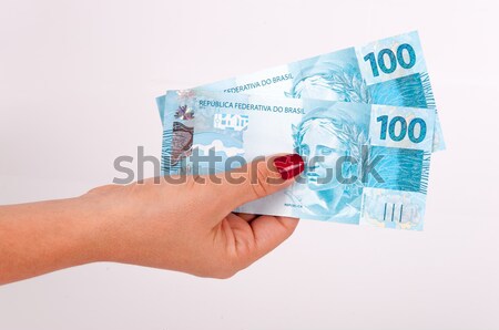 Woman's hand and Brazilian money Stock photo © cifotart