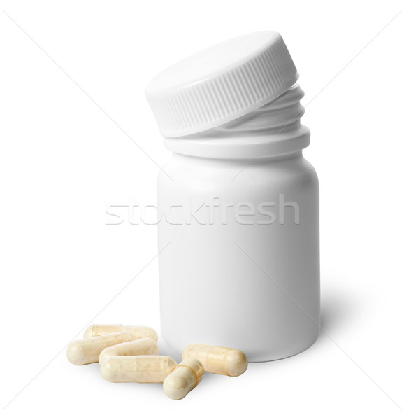 Beige capsule near the plastic bottle Stock photo © Cipariss
