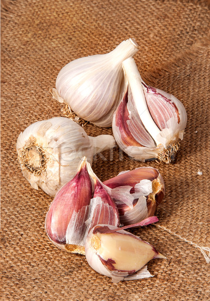 Garlic scattered on sackcloth Stock photo © Cipariss