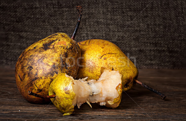 Two pears and stub on wooden table Stock photo © Cipariss