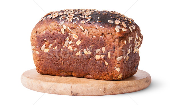 Unleavened bread with seeds on wooden board Stock photo © Cipariss