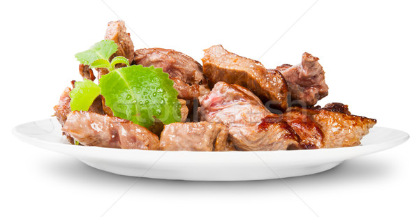 Grilled Meat On A White Plate Rotated Served With Mint Leaf Stock photo © Cipariss