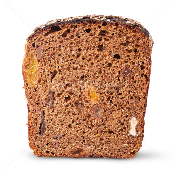Piece unleavened of black bread with nuts and dried fruit Stock photo © Cipariss