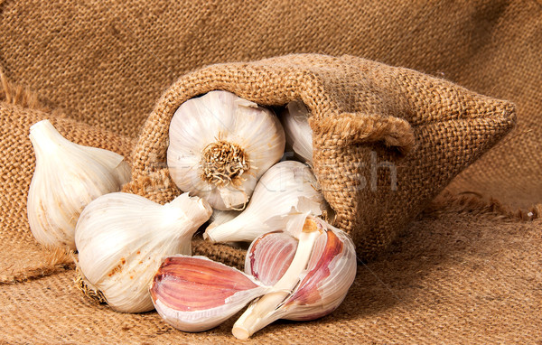 Whole garlic and cloves of garlic in a bag Stock photo © Cipariss