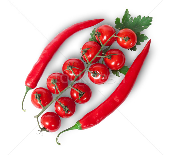 Stock photo: Two chili pepper and cherry tomatoes on stem with parsley