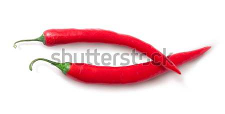 Two red chili peppers crossed Stock photo © Cipariss