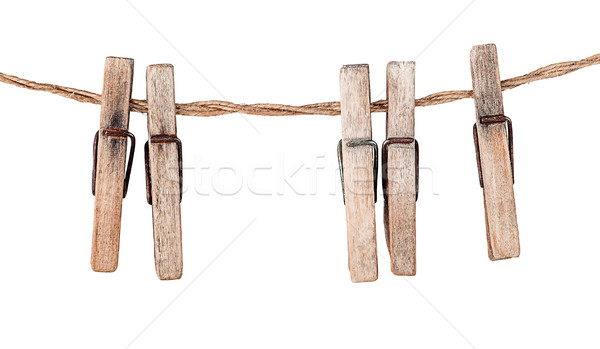 Five old clothespins on rope Stock photo © Cipariss